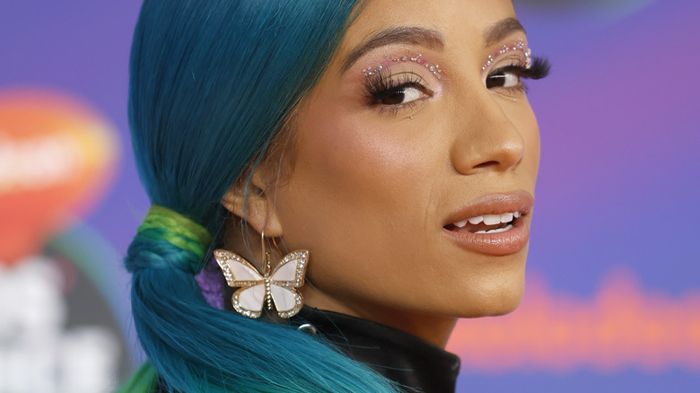 Sasha Nanks wearing butterfly earing