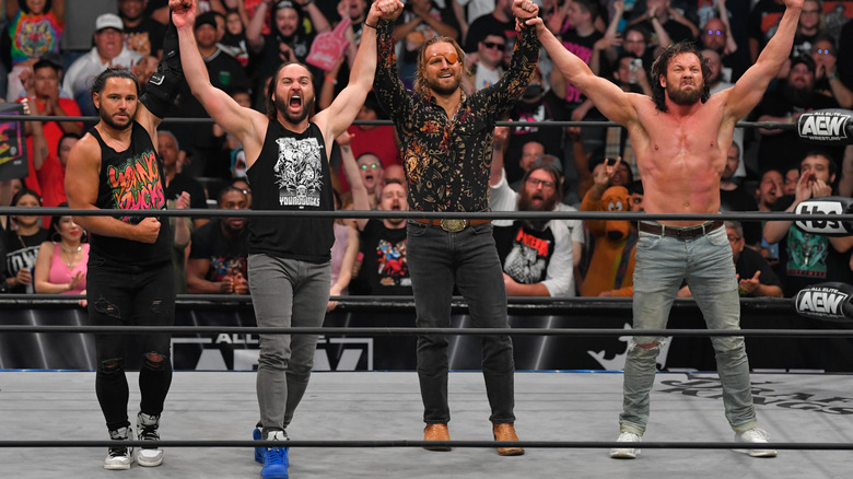 The Elite stand together triumphant