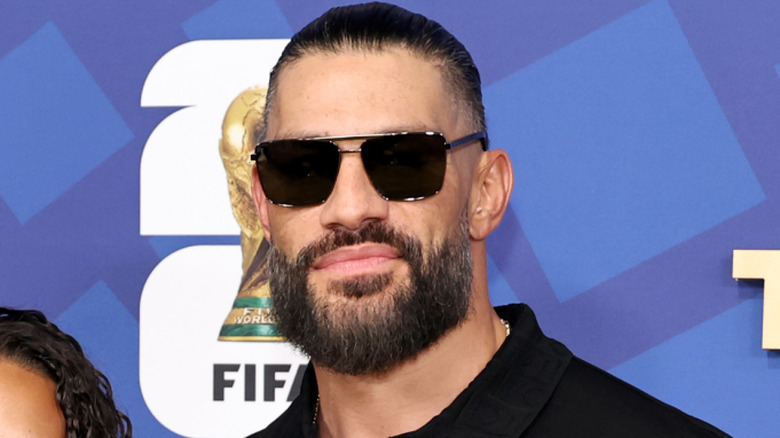 Roman Reigns wearing sunglasses
