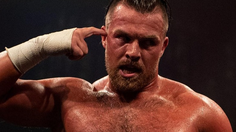 Joe Coffey pointing to his head