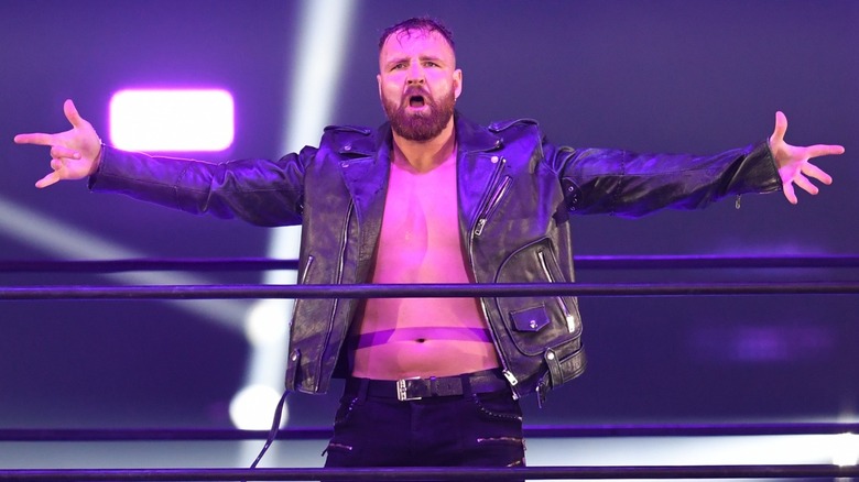 Jon Moxley with his arms spread in the ring
