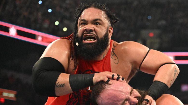 Jacob Fatu wrestling Braun Strowman in WWE