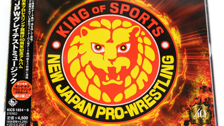 new japan pro wrestling logo floating in a fire background