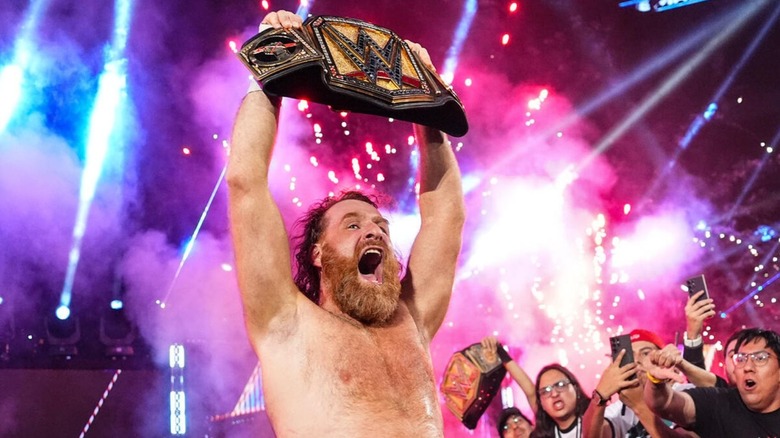 Sami Zayn hoists the Undisputed WWE Championship high after defeating CM Punk on the September 11, 2026 edition of 