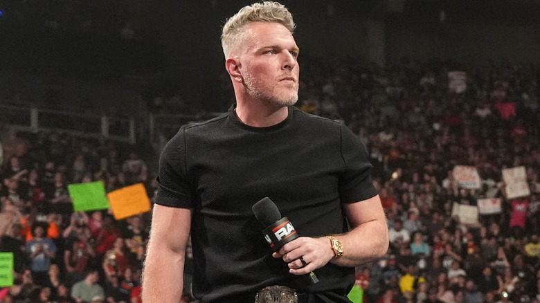 Pat McAfee holding a microphone