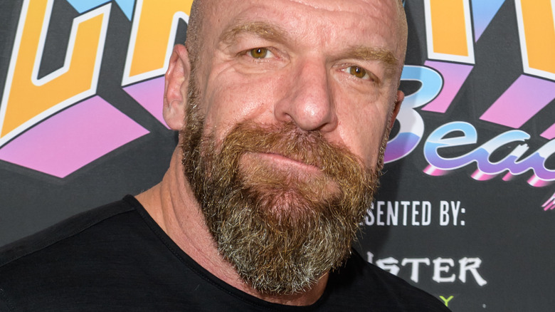 Triple H Poses At A Promotional Event