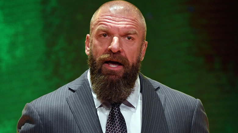 Triple H wearing a suit