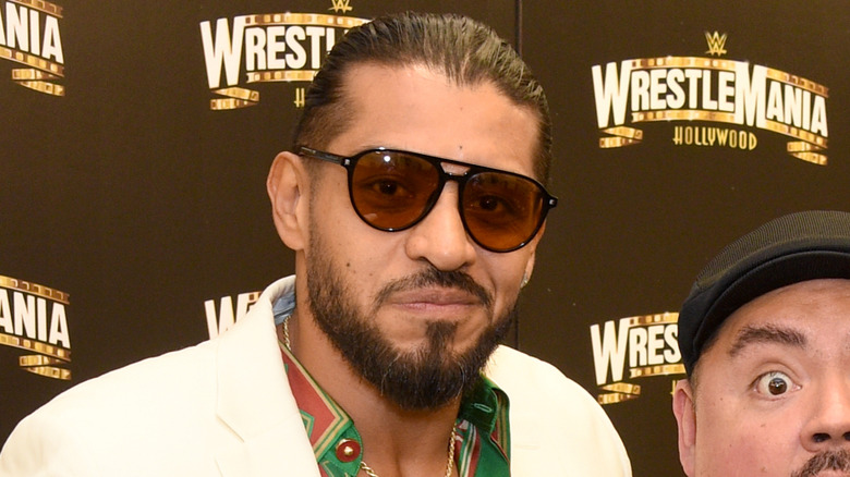 Santos Escobar wearing sunglasses