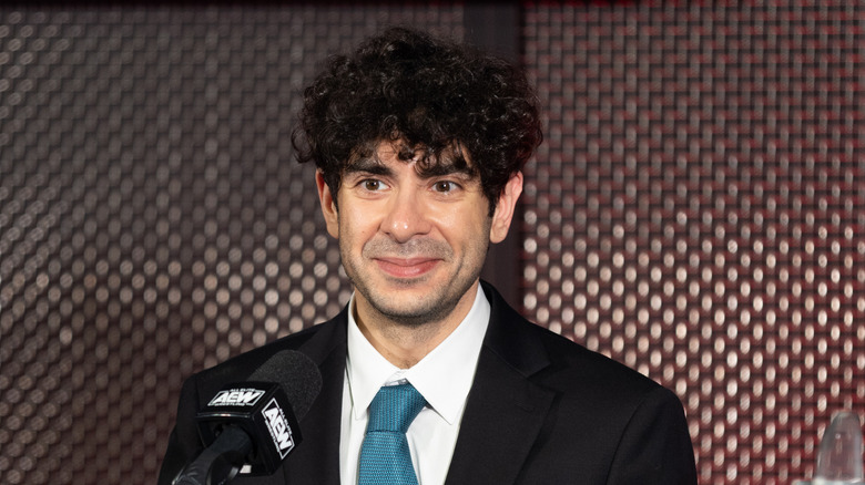 Tony Khan at a press conference 
