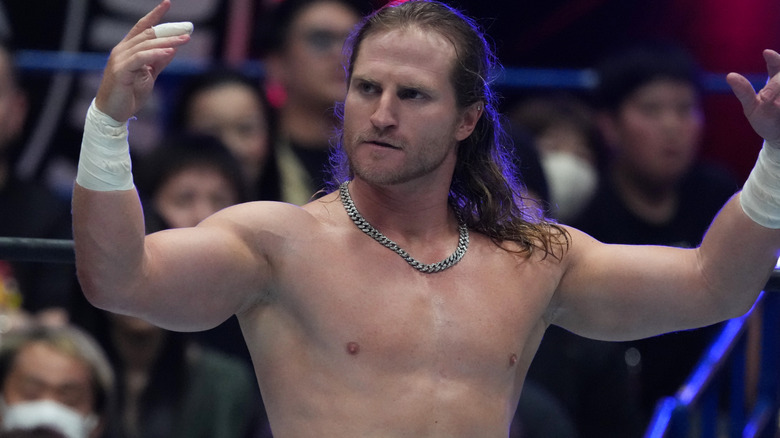 Clark Connors wearing a silver chain necklace