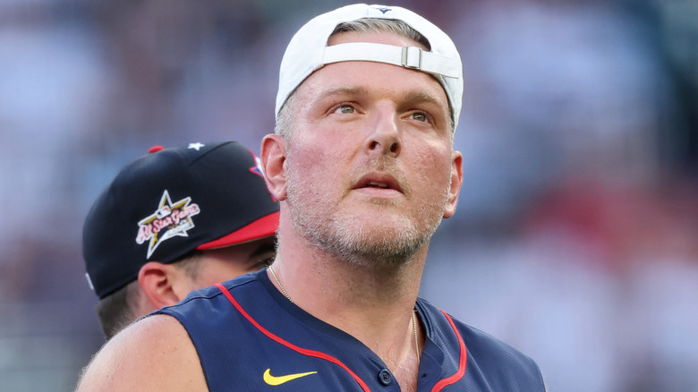 Pat McAfee wearing a backwards hat