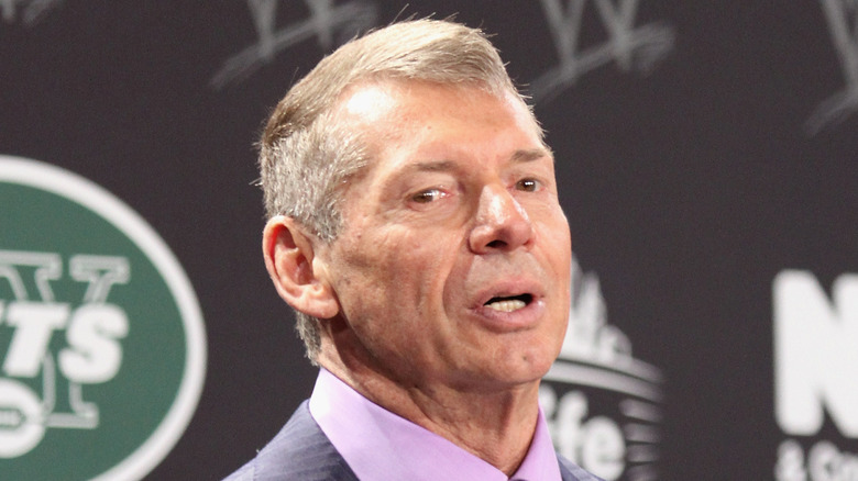 Vince McMahon speaking at a press conference