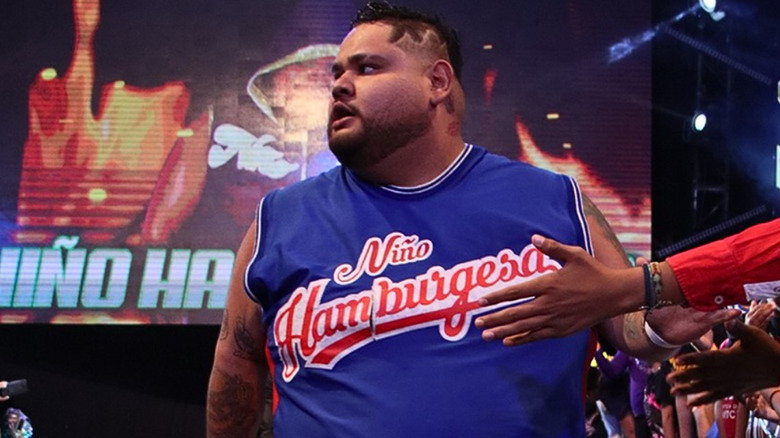 Nino Hamburguesa wearing a navy blue shirt