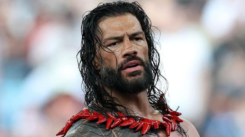 Roman Reigns with wet hair wearing the ula fala
