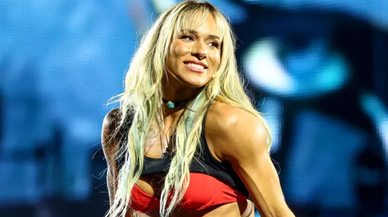 Sol Ruca wearing a red and black top