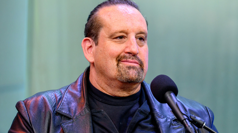 Tommy Dreamer is wearing a black jacket