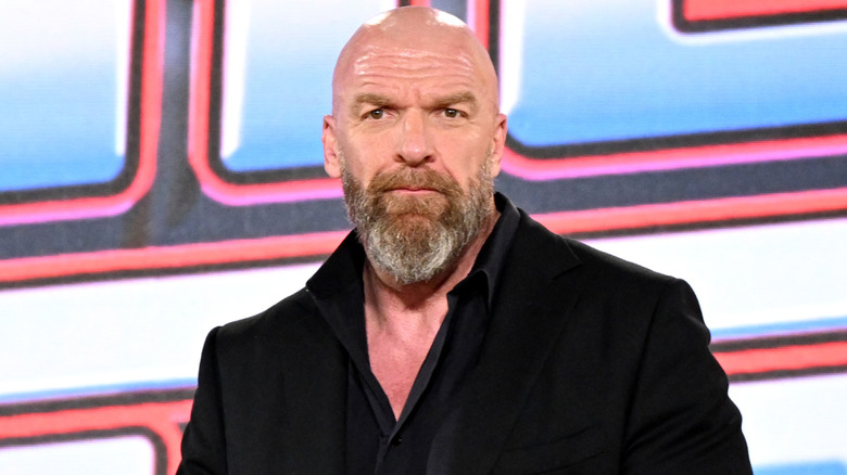 Triple H is wearing a suit