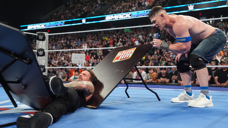 John Cena and CM Punk trying to repeat the pass, but reversing roles