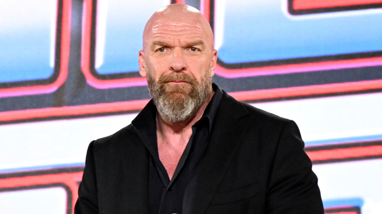 Triple H is wearing a suit