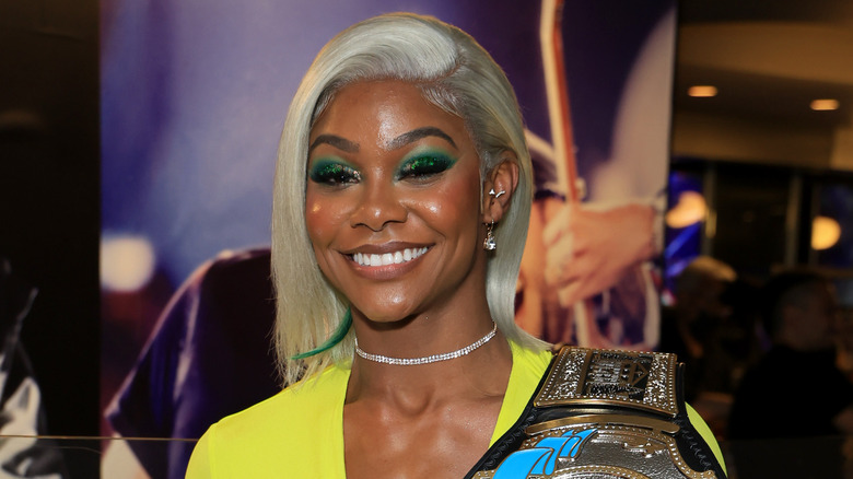 Former TBS champion and former AEW star Jade Cargill poses with the title