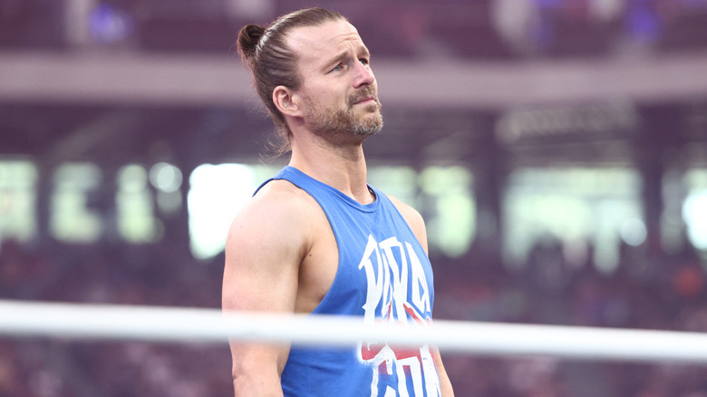 Adam Cole stands in the ring and addresses the fans as he says goodbye after he had to relinquish the TNT Championship due to health issues.