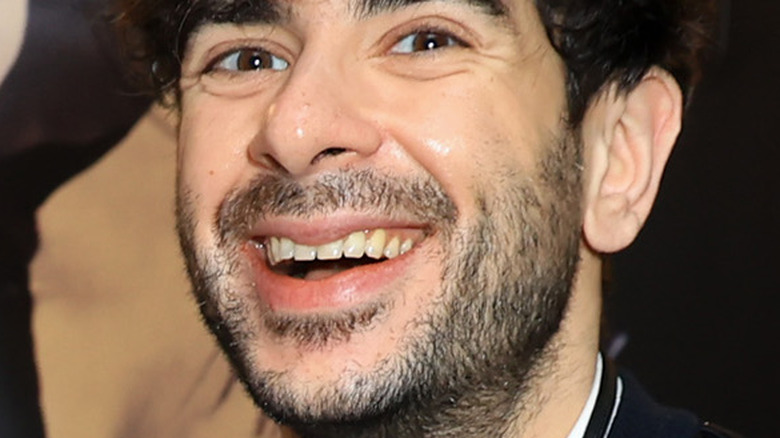 Tony Khan smiles