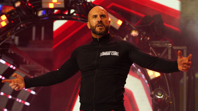 Claudio Castagnoli poses at the top of an AEW entrance before a match