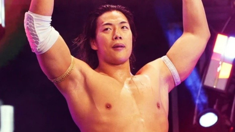 Konosuke Takeshita raises his arms
