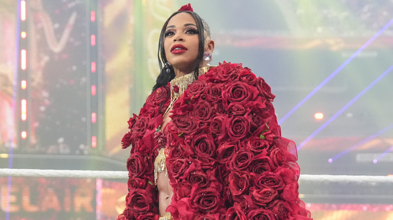 Bianca Belair wearing a red jacket made of roses
