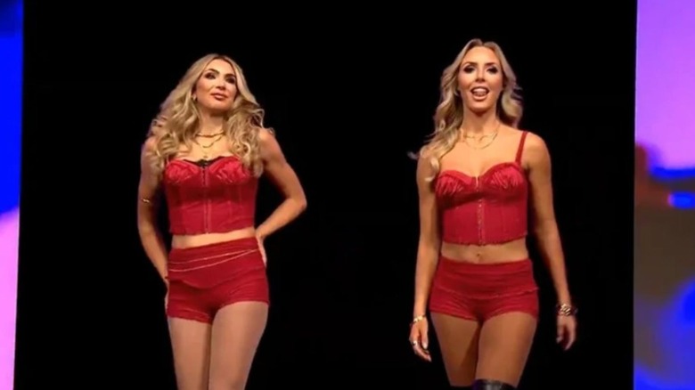 Cassie Lee and Jessica McKay, The IInspiration, look to the ring from the stage after their return during the pre-show of TNA Wrestling's Against All Odds.