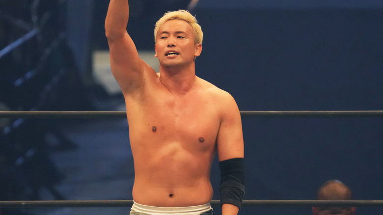 Kazuchika Okada with an arm raised