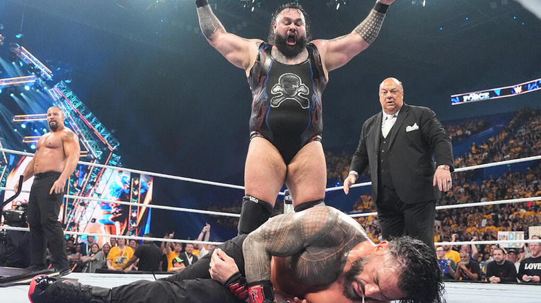 Bronson Reed stands over Roman Reigns