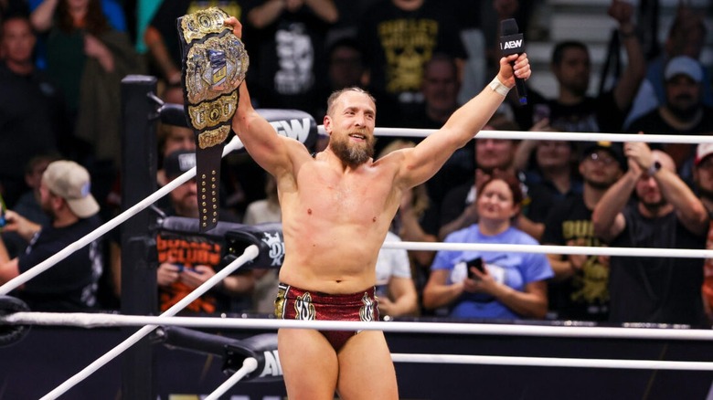 Bryan Danielson feels on top of the world with the AEW World Championship and microphone in hand