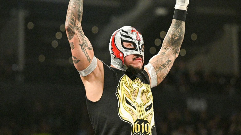 Rey Mysterio poses in the ring ahead of a match against Austin Theory on 