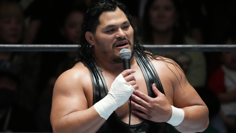Jeff Cobb holding a micrphone