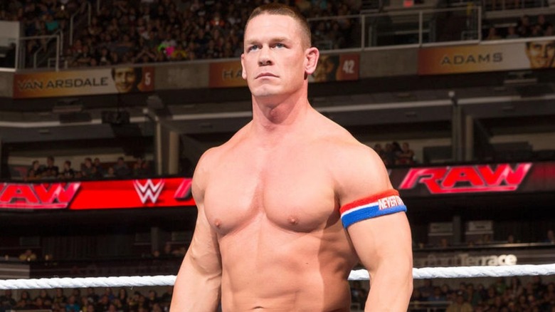 WWE Superstar and Hollywood actor John Cena stands in the ring before a match.