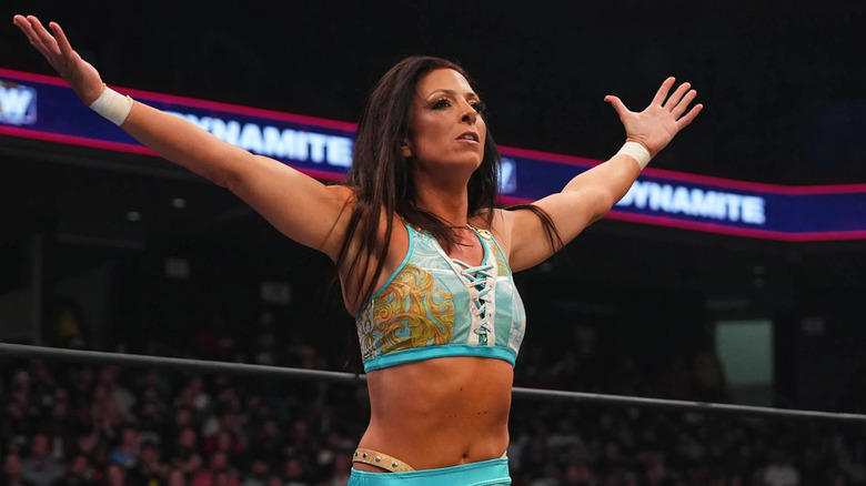 Serena Deeb with arms raised