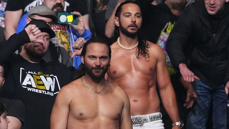 The Young Bucks standing amongst a crowd
