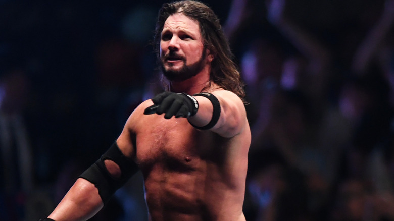 AJ Styles reaches out his hand
