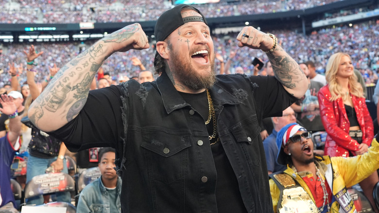 Jelly Roll flexing at a WWE event