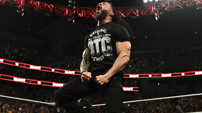 Roman Reigns yelling and flexing in the ring