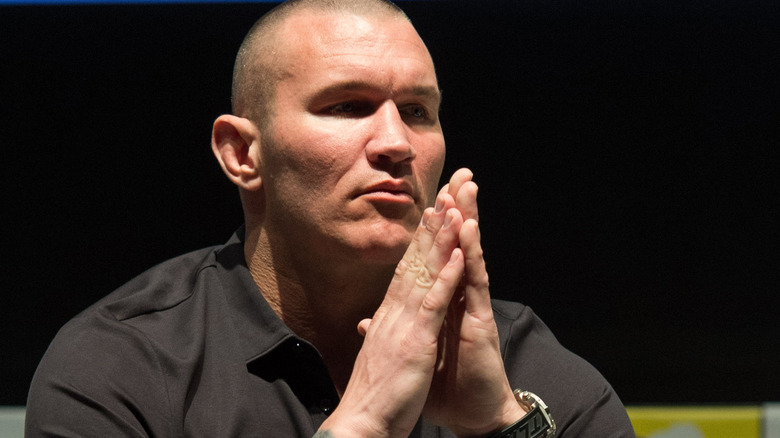 Randy Orton sits with hands together