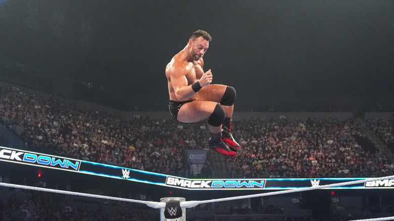 LA Knight, mid-jump