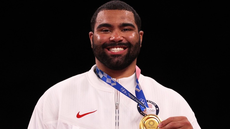 Gable Steveson smiling with Olympic Gold Medal