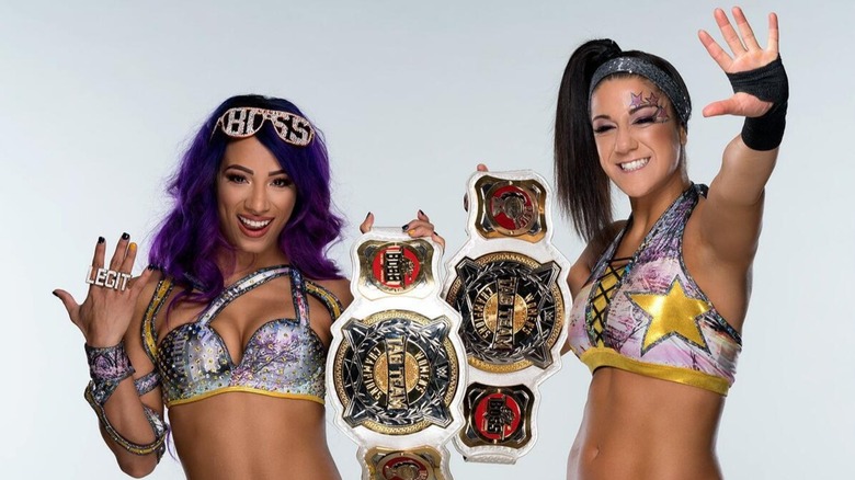 Newly crowned WWE Women's Tag Team Champions, Sasha Banks and Bayley, pose together