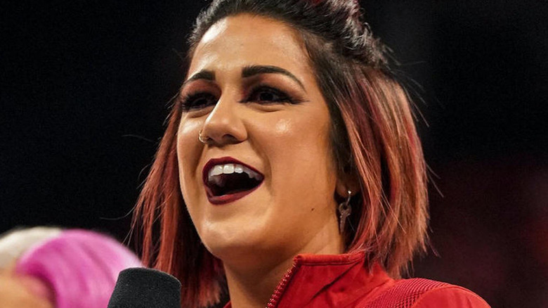 Bayley with a microphone