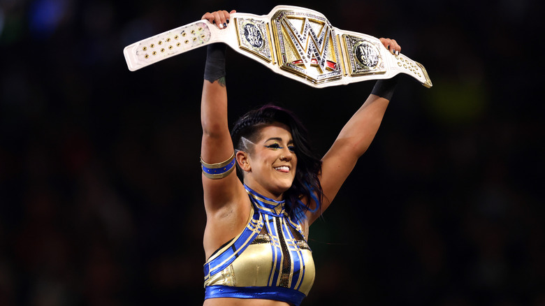 Bayley holding up her title at WrestleMania 40