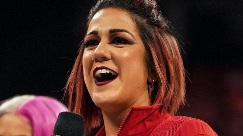 Bayley with a microphone