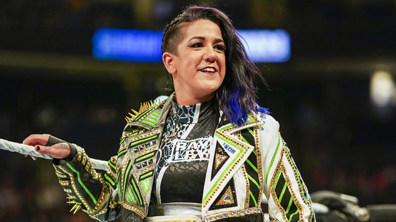 Bayley in a WWE ring with a title around her waist