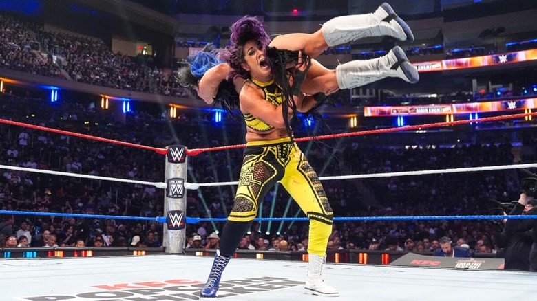 Bayley throws Lyra Valkyria over her shoulder during their match at the July 2026 edition of WWE Saturday Night's Main Event.